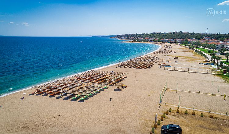 The main beach of Nea Potidea with a volleyball court